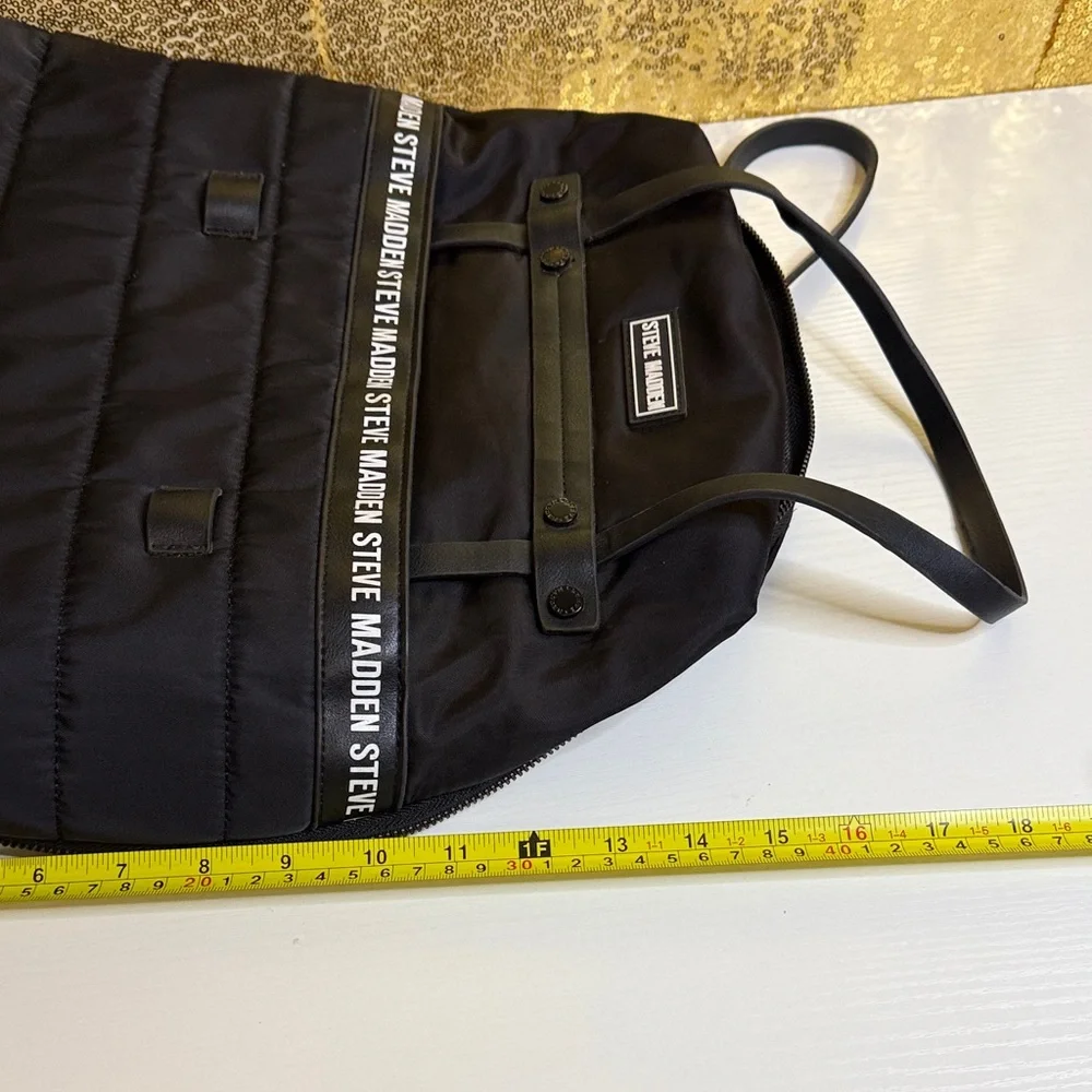 Steve Madden Bjodah Black Quilted Backpack with carry handles and branded strap